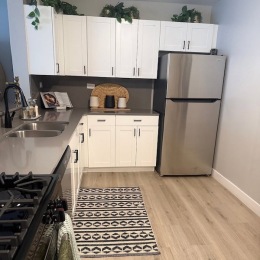 a kitchen with white cabinets