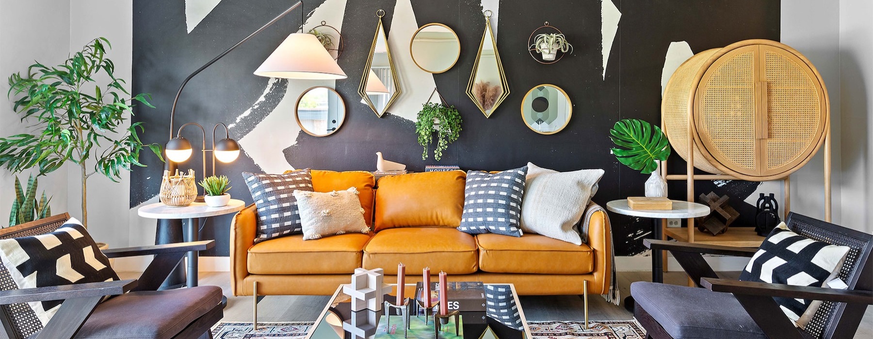 a living room with a couch and chairs